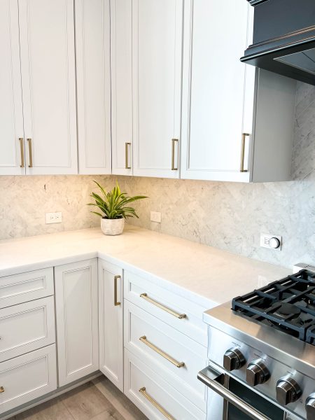 White-Kitchen-Cabinets-with-Gold-Accessories