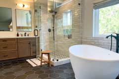 Black-hexagon-floor-tile-with-Wood-Toned-Cabinets