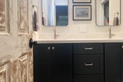 Navy-vanity-with-decorative-tile-flooring