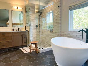 bathroom renovaction company after picture with frameless shower and soaking tub