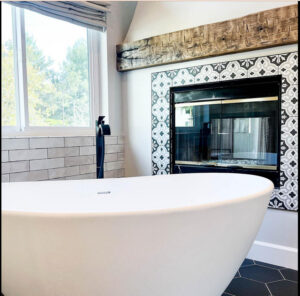 Orange county general contractor adds fireplace to San Clemente bathroom to match black and white theme