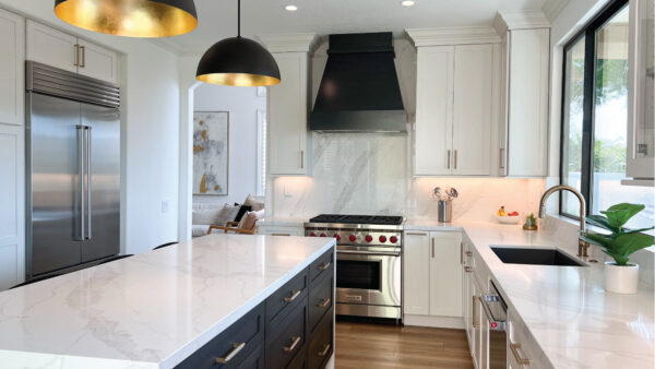 Black and white kitchen design with matte gold accents